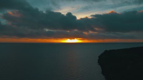 Beautiful-shot-of-a-sunset-near-a-tropical-island
