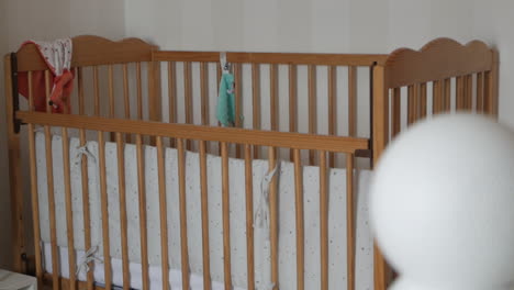 Wooden-crib-background,-out-of-focus-Security-camera-on-baby´s-room