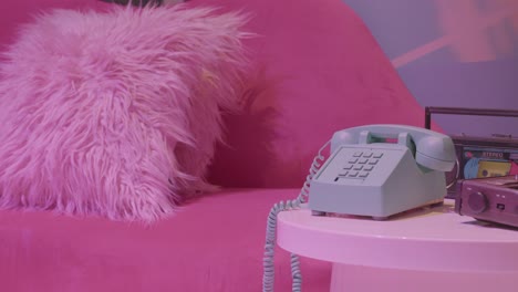 Retro-pop-1980's-scene-with-telephone-pink-lips-chair-kitschy-decor