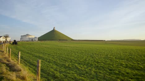 Wide-angle-of-lion's-mound-around-arable-land-and-next-to-the-museum-of-Waterloo