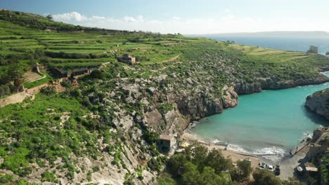 AERIAL:-Hills-of-Magrr-Ix-Xini-Bay-with-Mediterranean-Sea-Water-Washing-Shores-of-Gozo-Island