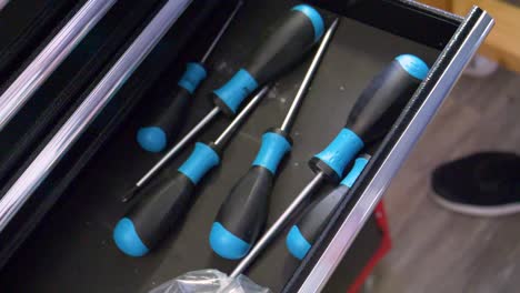opening-a-drawer-with-screwdrivers-inside