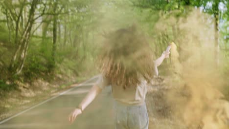 Freedom-concept-of-teenager-girl-running-with-an-orange-smoke-flare-in-the-woods,-Day-for-the-Elimination-of-Racial-Discrimination