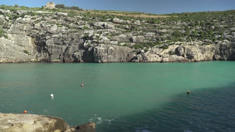 Slow-Panorama-of-Magrr-Ix-Xini-Bay-Beach-Cliffs-and-Turquoise-Colour-Mediterranean-Sea