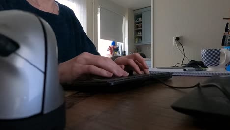 woman-typing-on-a-mechanical-keyboard