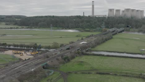 Train-Lines-Construction-Work,-Canal,-Aerial-Slow-Rise,-Landscape,-Dull-Day,-Long-Eaton,-UK,-Ratcliffe-Power-Station,-Energy,-Cooling-Towers,-Industry,-Transportation,-Travel,-Winter,-Grey