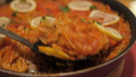 Close-up-view-of-popular-spanish-dish-homemade-Fideuà-which-is-a-seafood-dish-originated-from-the-coast-of-Valencia