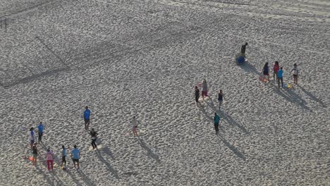 A-group-of-females-doing-a-workout-at-Copacabana-Beach-in-Rio-de-Janeiro-in-early-morning-sunshine