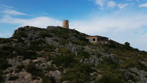 Watchtower-in-Mallorca-slow-pedestal-up-dramatic-aerial-reveal