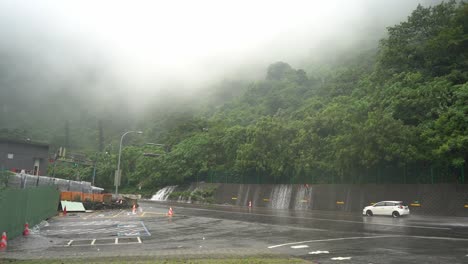 Dangerous-weather-condition-with-heavy-rainfall-and-thick-fog-environment-caused-hazardous-driving-visibility-at-Hsuehshan-Tunnel-at-Hualien-City,-Taiwan