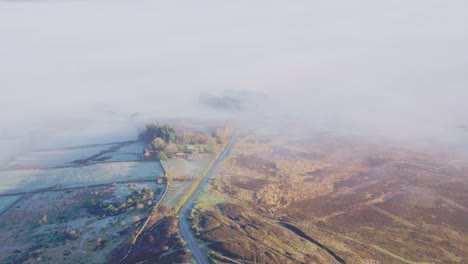 Lealhome-drone-flight-from-moor-top-moving-over-mist-shrouded-valley-Autumn-Winter---DJI-Inspire-2