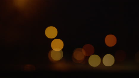 Out-of-focus-driving-drive-night-time-after-dark-bokeh-street-long-dull-trip-transition-car-automotive-driver-lights-passing-by-time-late-road-trip-ahead-artistic-listening-radio-wave-moody-indie