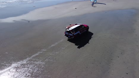 drone-view-circling-around-a-red-lifeguard-truck-at-pacific-beach
