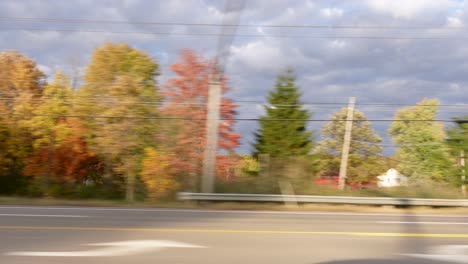 Footage-Of-Countless-Trees-From-Car-During-Autumn-In-Residential-Area,-Cloudy-Sky,-Ohio