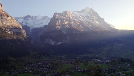 aerial-drone-footage-dolly-left-to-right-over-Grindelwald-with-impressive-view-of-Eiger-North-Face-and-Fiescherhorns