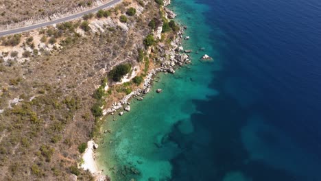 AERIAL-Fly-By-of-the-Beautiful-Albanian-Coastline-with-a-Coastal-Road