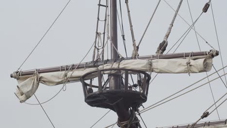 Galleon-Andalucia-replica-ship-detail-steady-shot-of-forecastle-mast-and-sail-while-docked-in-Valencia-in-slow-motion-60fps