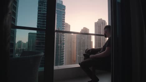 Lonely,-Sad,-Unhappy-Man-in-Luxury,-Skyscraper-View-on-Balcony