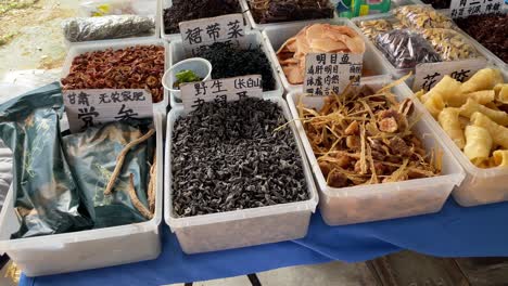 Array-of-traditional-Chinese-dried-food-in-baskets-at-a-local-market