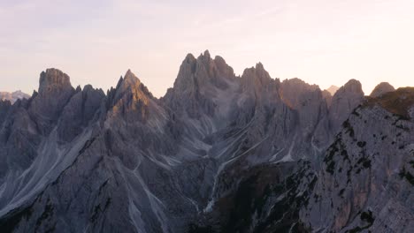 Hikers-Enjoy-View-of-Cadini-Group-during-Sunset-in-the-Italian-Dolomites