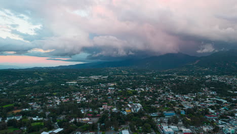 Aerial-timelapse-in-the-city-right-before-dusk,-amazing-environment-in-the-city-with-colorful-clouds-fading