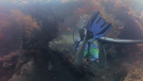 POV-Scuba-diver-sunken-ship-wreck-uss-liberty-scuba-diving-in-bali-indonesia