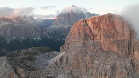 Aerial-forward-flight-over-lighting-Nuvolau-Group-Mountains-in-Dolomites-during-golden-sunset