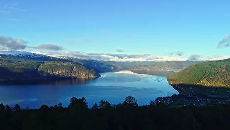 Aerial-view-of-idyllic-Fjord-surrounded-by-Norwegian-mountains-in-summer-season