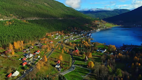Village-on-fjord-green-bank-in-Norway