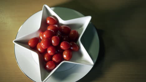 Baby-plum-tomatoes-in-white-star-shaped-dish-and-from-left-to-right-movement