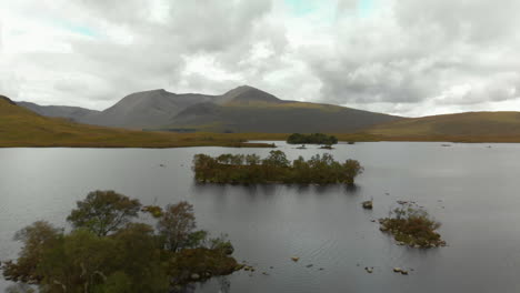 Drone-shot-flying-over-Lochan-na-h-Achlaise-with-mountains-in-background
