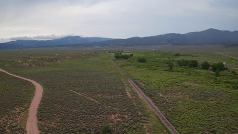 Drone-view-of-the-countryside-of-Colorado-with-mountains-in-the-background