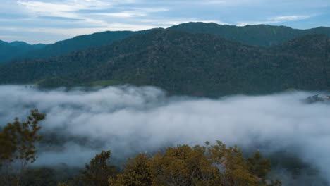 Time-Lapse-Of-Low-Clouds-And-Fog-Over-Mountain-Or-Landscape-and-Small-Village