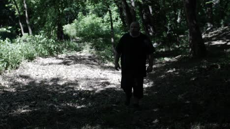 A-man-walking-through-forest-trees