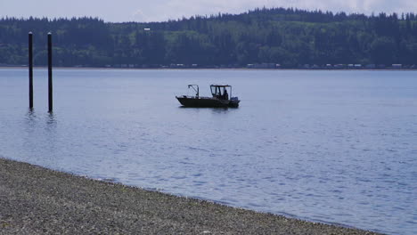 Small,-nondescript-fishing-floating-near-dock-at-Camano-Island-State-Park,-WA-State-20sec-60fps-Version-5