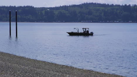 Small,-nondescript-fishing-floating-near-dock-at-Camano-Island-State-Park,-WA-State-20sec-24fps-slow-motion