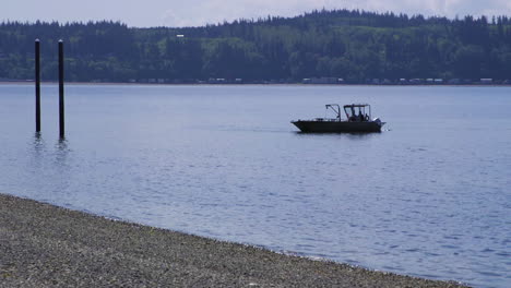 Small,-nondescript-fishing-floating-near-dock-at-Camano-Island-State-Park,-WA-State-30sec-60fps-Version-6