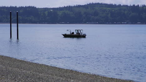 Small,-nondescript-fishing-floating-near-dock-at-Camano-Island-State-Park,-WA-State-10sec-60fps-Version-4