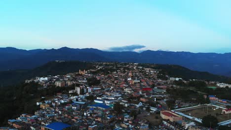 aerial-shot-of-village-on-the-mountain-plateau