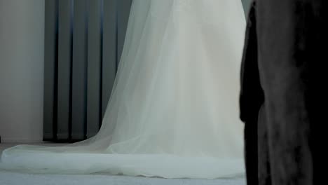wedding-dress-slide-shot-during-wedding-prep-on-wedding-day-at-house