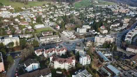 Stationary-aerial-drone-shot-above-the-town-of-Unterengstringen-in-the-canton-of-Zürich,-Switzerland