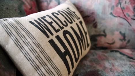 Antique-looking-pillow-with-"Welcome-Home"-printed-on-it