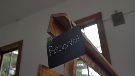 A-Reserved-Sign-hanging-on-a-Pew-in-an-Old-Church
