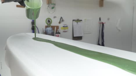 speed-ramp-slow-motion-paint-pouring-onto-new-surfboard