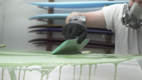 close-up-painting-surfboard-slow-motion-100fps