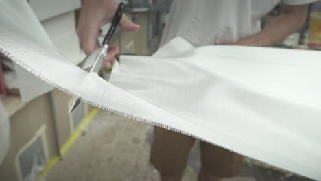 surfboard-being-made-cutting-fibre-glass