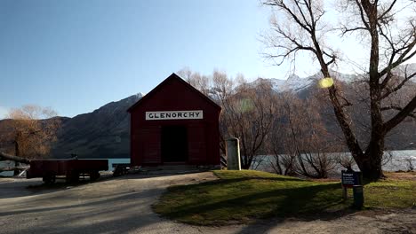 Glenorchy-Queenstown-New-Zealand-famous-red-shed-on-a-winter-sunset