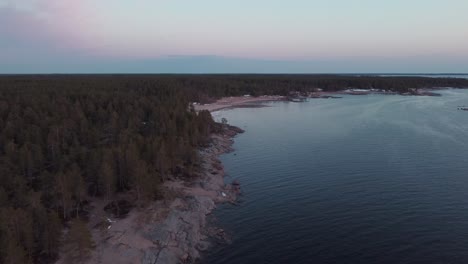 Aerial-view-of-Finland's-coast-during-sunset-in-Faboda-Beach,-Pietarsaari,-Finland,-aerial-dolly-shot