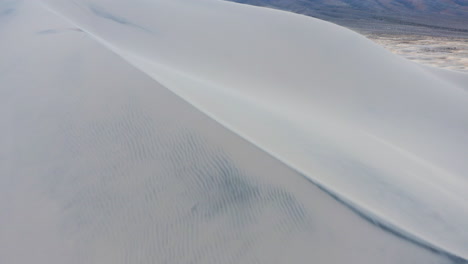 Flying-over-a-large-sand-dune-on-Kelso-dunes-Mojave-national-preserve