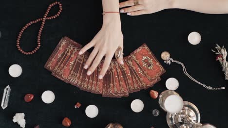 Cartomancy-fortune-telling-or-divination-concept-using-a-deck-of-cards,-top-down-view-of-card-interpretation